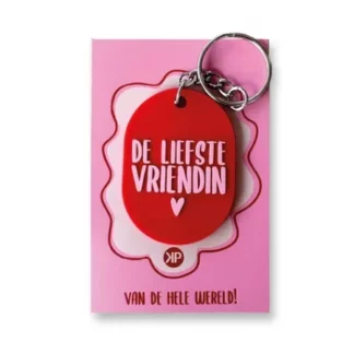 Sleutelhanger ovaal 50x36mm - De liefste vriendin (rood met roze tekst)